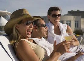 People drinking cocktails on a yacht