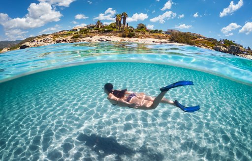 Charter guest snorkeling in clear waters