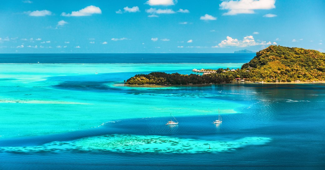 Aerial landscape of blue waters in French Polynesia