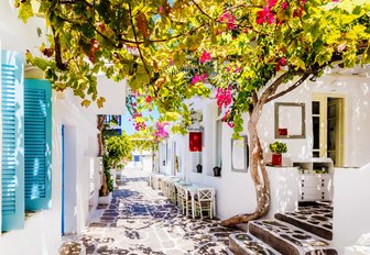 a street in charter hotspot mykonos on a summers day