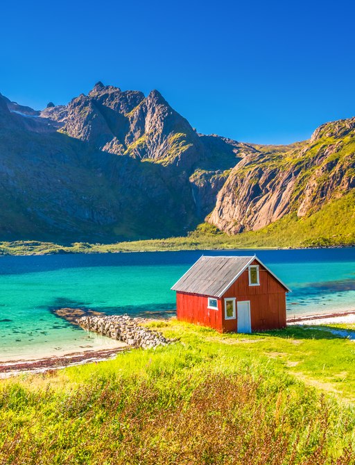 Red Rorbu House on a beautiful beach in Lofoten, Norway