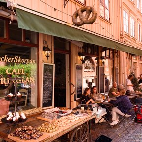 A cafe front in Sweden with green canopy